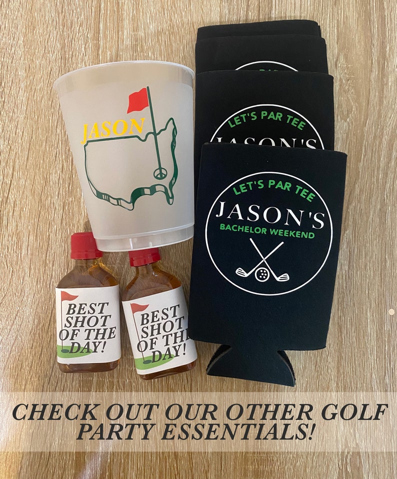 May include: A set of golf-themed party supplies featuring a white plastic cup with a green golf course design and the name "Jason" in yellow letters, two small bottles with "Best Shot of the Day!" labels, and four black can coolers with the text "Let's Par Tee Jason's Bachelor Weekend" in white.