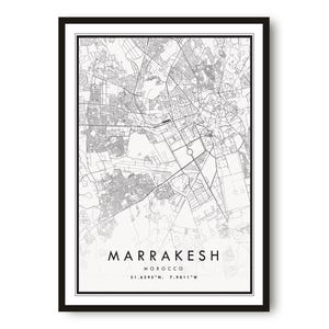 May include: A framed monochrome map print of Marrakesh, Morocco. The detailed city map shows streets and buildings. The city name and country are printed in a modern font at the bottom. The frame is black.