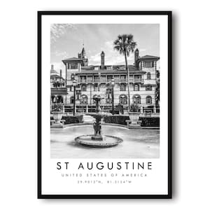 May include: Monochrome framed print of a historic building in St. Augustine, Florida. The image shows a fountain and a palm tree. Text at the bottom reads "ST AUGUSTINE UNITED STATES OF AMERICA" with coordinates.