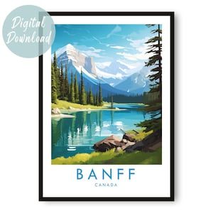 May include: A framed art print featuring a scenic view of Banff National Park in Canada. The artwork depicts a serene lake surrounded by mountains and evergreen trees, with the word "BANFF" and "CANADA" in blue at the bottom. A digital download is available.
