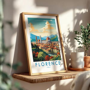 May include: A framed art print featuring a stylized illustration of the Florence, Italy skyline, including the Duomo and Giotto's Campanile, with the text FLORENCE ITALY printed in blue at the bottom against a white background.
