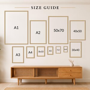 a wall with a series of framed artworks arranged in a grid-like pattern, providing a size guide for the different frame sizes.
