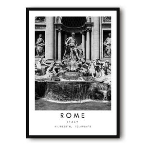 May include: Monochrome framed print of the Trevi Fountain in Rome, Italy. The image includes the text "ROME ITALY" and coordinates. The fountain is the central feature, with sculptures and flowing water. A classic piece of wall art.