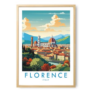 May include: A framed travel poster featuring a stylized illustration of the Florence, Italy skyline, including the Duomo and surrounding buildings, with a river in the foreground, lush trees, and mountains under a blue sky with clouds.