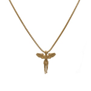 May include: A gold chain necklace with an angel pendant. The angel is depicted with wings outstretched and a serene expression.