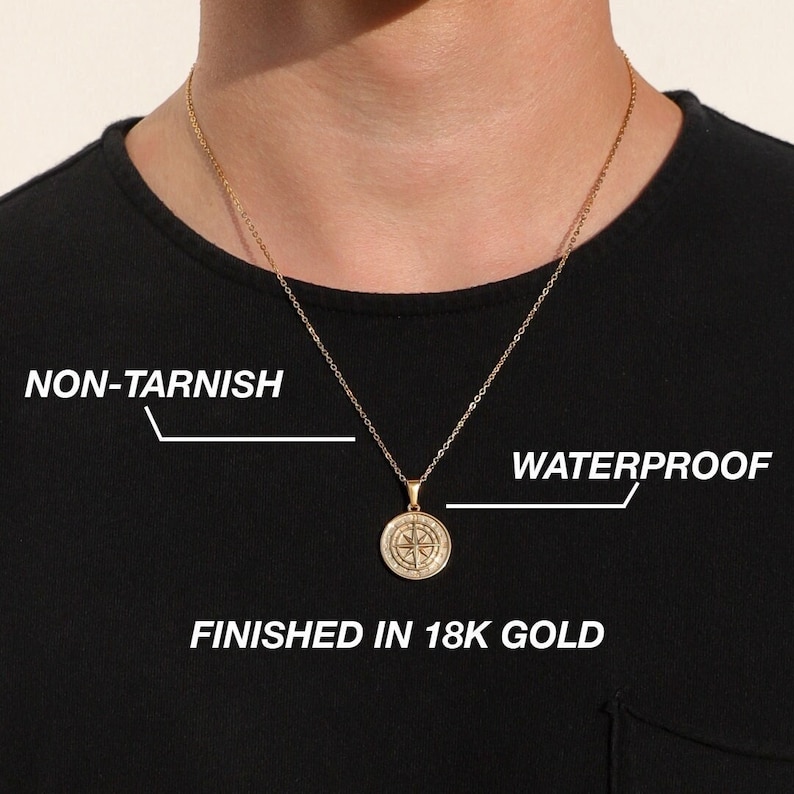 May include: A gold chain necklace with a compass pendant. The necklace is non-tarnish and waterproof. It is finished in 18k gold.