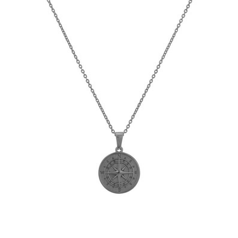 May include: A black chain necklace with a compass pendant. The compass is round and has a black finish. The compass has the letters N, S, E, and W around the edge.