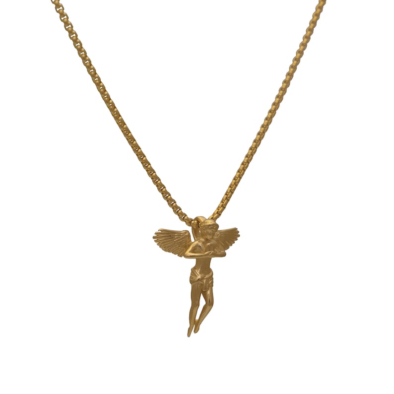 May include: A gold chain necklace with a gold angel pendant. The angel is depicted with wings outstretched and a serene expression.