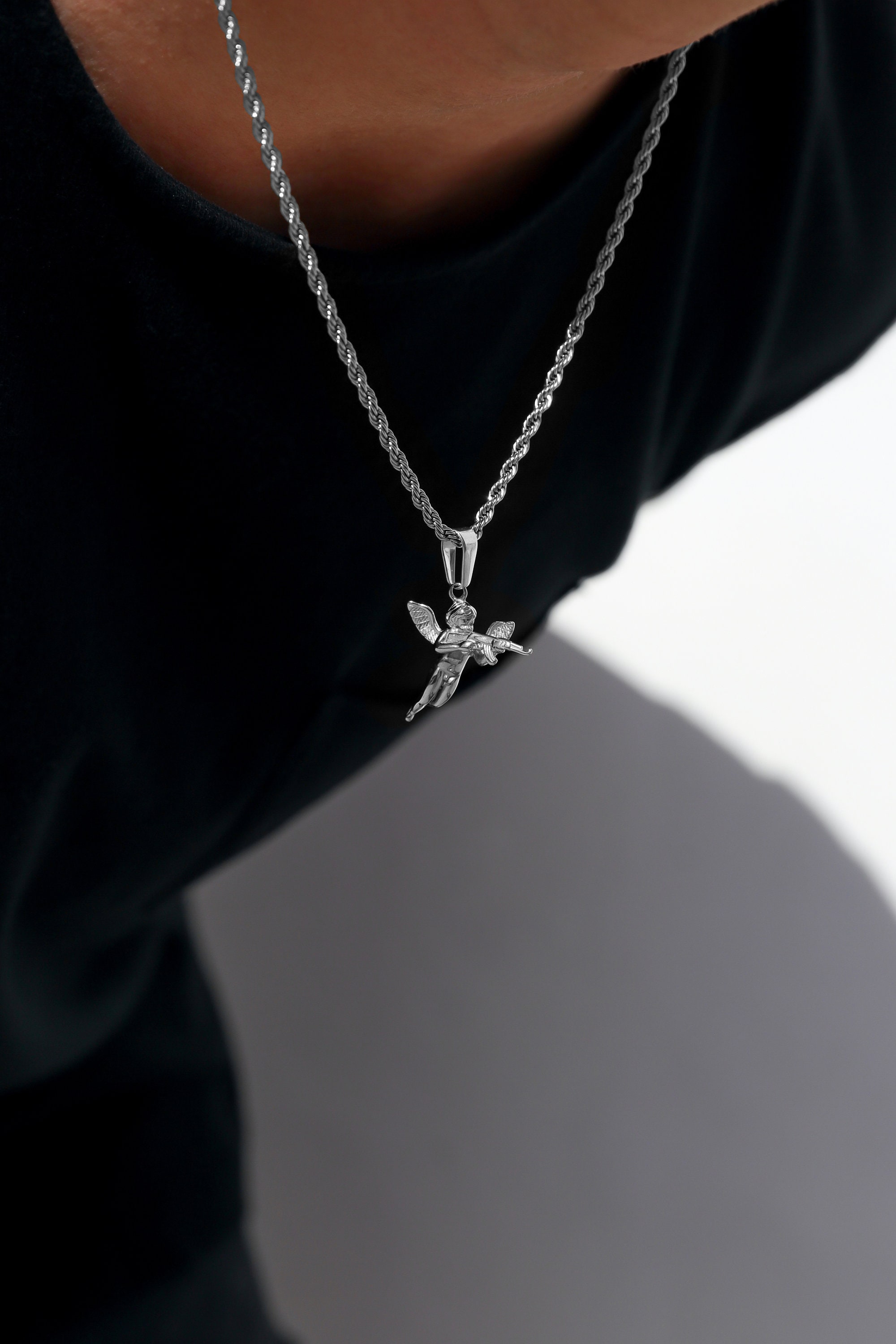 Angel with deals gun necklace