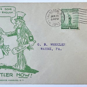 May include: A vintage envelope featuring a green ink illustration of Uncle Sam confronting a figure with a swastika armband. Text includes "YOU'VE GONE FAR ENOUGH!", "AID TO BRITAIN", and "STOP HITLER NOW!". It has two 1943 postage stamps and a Washington, D.C. postmark.