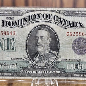 1923 Un dollaro Dominion del Canada - VF (Molto Bello) - Sigillo viola, serie C, tipo molto raro per questa banconota - McCavour-Saunders - Grado superiore