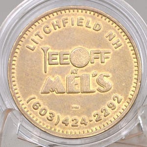 Litchfield, New Hampshire Tee Off At Mel&#39;s Golf Token - Golf Token at Mel&#39;s NH - Litchfield Tee off At Mel&#39;s with grooved reverse Token