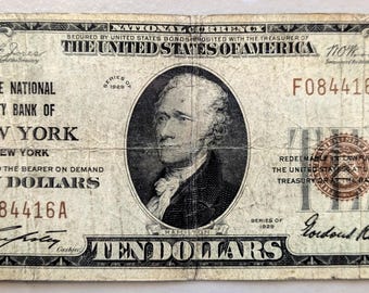 Może przedstawiać: Stary banknot 10 dolarowy National City Bank of New York z portretem Aleksandra Hamiltona. Banknot pochodzi z 1929 roku i ma numer seryjny F084416A.
