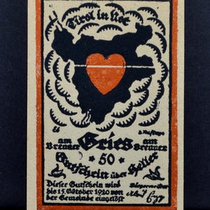 May include: Vintage postcard with a black silhouette of a region, a red heart, and text. The text includes "Tirol in Rot" and "Brenner". The postcard has a red border and is on a cream background.