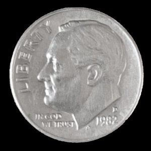 May include: A silver US dime coin with the words "Liberty" and "In God We Trust" and the year "1982" inscribed on it. The coin features a profile of President Franklin D. Roosevelt.