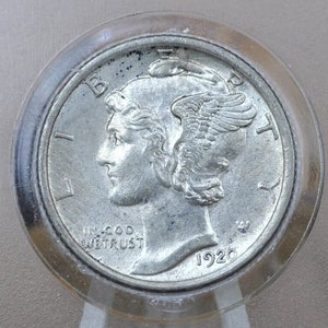May include: A silver 1920 Mercury dime coin with the words "Liberty" and "In God We Trust" on the front. The coin is in a clear plastic holder.