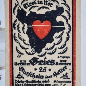 May include: Vintage printed card with a black silhouette of a region, a red heart, and German text. The card has a red border and is on a cream background. The text includes "Tirol in Rot" and "Gutschein über Heller."