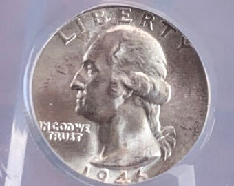 May include: A silver US quarter dollar coin with the year 1945 inscribed on the bottom. The coin features a profile of George Washington with the words "LIBERTY" above and "IN GOD WE TRUST" below.