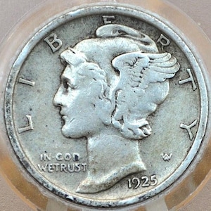 May include: A silver 1925 Walking Liberty Half Dollar coin with the inscription "In God We Trust" and the letter "W" mint mark. The coin features a profile of Liberty with a winged cap and the inscription "Liberty" on the left side and "E Pluribus Unum" on the right side.