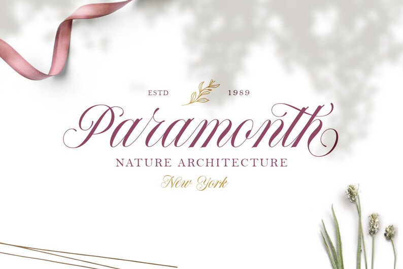 May include: A logo for a company called "Paramount Nature Architecture" in a burgundy script font. The logo is set against a white background with a gold leaf design and the text "ESTD 1989" in a gold sans-serif font. The text "New York" is also in a gold sans-serif font.