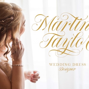 May include: A bride in a white lace wedding dress with a veil, looking out a window. The text "Martine Taylor Wedding Dress Designer" is written in gold script.