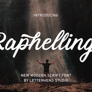 May include: Image advertising a new modern script font named "Raphelling" by Letterhend Studio. The font name is in large, white, cursive letters. The background features a person with arms raised in front of a waterfall.