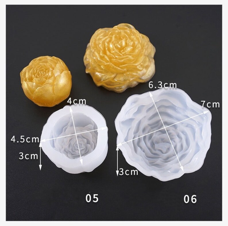 May include: The image shows three rose-shaped molds and two finished resin castings. The molds are white, and the castings are gold. The molds are labelled 05 and 06, with measurements of 3 cm, 4 cm, 4.5 cm, 6.3 cm, and 7 cm.