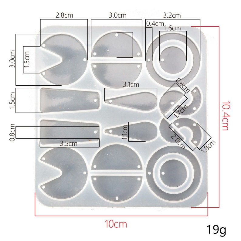May include: A clear silicone mold with 14 different shapes for making jewelry. The mold measures 10.4 cm by 10 cm and weighs 19 grams. The shapes include circles, ovals, teardrops, and half-circles.