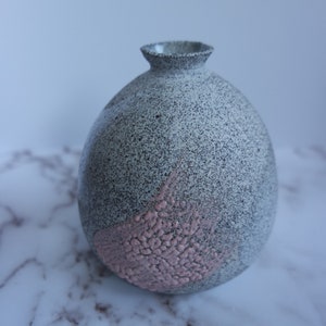 Black and white vase with pink accents