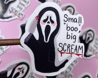 May include: A white sticker featuring a black and white illustration of Ghostface from the Scream film franchise. The sticker has red dripping paint and the text "Small "boo", big SCREAM".