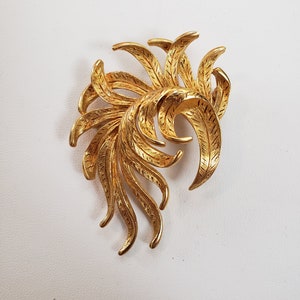 vintage gold colored brooch