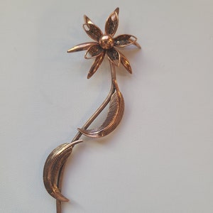 Vintage rose gold colored flower brooch
