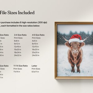 May include: A framed print featuring a Highland cow wearing a red Santa hat, standing in a snowy field. The print is in a gold frame. The image includes text indicating the available print sizes, such as 4x6 inches, 8x12 inches, and 10x15 inches.