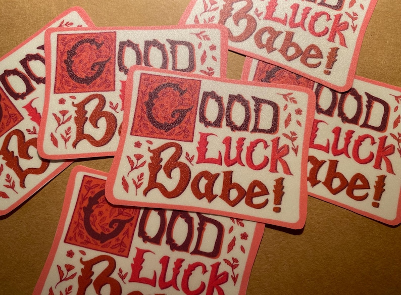 May include: A set of six pink and white stickers with the text "Good Luck Babe!" in a decorative font. The stickers have a vintage aesthetic and are perfect for adding a touch of whimsy to gifts, cards, or journals.