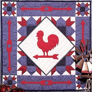 May include: A red rooster weather vane with a white arrow, surrounded by a blue and red quilt with a diamond pattern. The quilt is hanging on a wall with a wooden background.