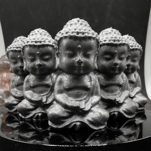 Shungite sitting Buddha carving