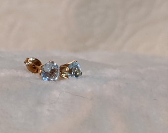 Blue topaz in gold stud earrings