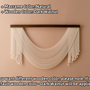 May include: A natural macrame wall hanging with a dark walnut wood dowel. The macrame is in the shape of a half-circle with long strands hanging down.  "If you want different wooden color, please note. If not, default wooden color - Dark Walnut will be applied."
