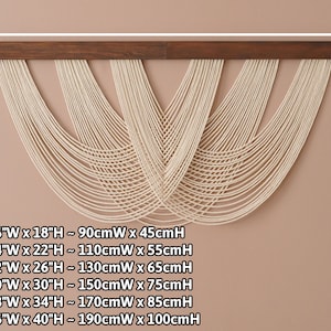 May include: A wall hanging featuring a dark brown wooden horizontal bar with off-white cotton cords draped in multiple overlapping U-shaped curves. The text lists dimensions from 36 inches wide by 18 inches high to 76 inches wide by 40 inches high.
