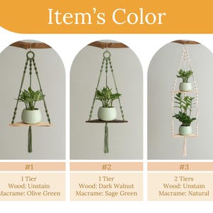 May include: Three macrame plant hangers with different wood and macrame colors. The first hanger is olive green with a single tier and unstained wood. The second hanger is sage green with a single tier and dark walnut wood. The third hanger is natural with two tiers and unstained wood.