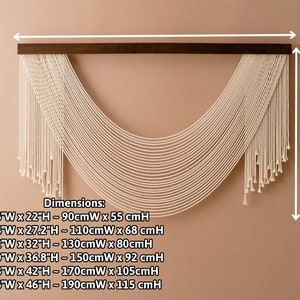 May include: A white macrame wall hanging with a wooden dowel at the top. The hanging is in the shape of a half-circle and has a fringe at the bottom. Dimensions are listed in inches and centimeters: +36"W x 22"H - 90cmW x 55 cmH, +44"W x 27.2"H - 110cmW x 68 cmH, +52"W x 32"H - 130cmW x 80cmH, +60"W x 36.8"H - 150cmW x 92 cmH, +68"W x 42"H - 170cmW x 105cmH, +76"W x 46"H - 190cmW x 115 cmH.