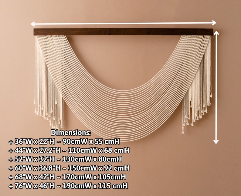 May include: A white macrame wall hanging with a wooden dowel at the top. The hanging is in the shape of a half-circle and has a fringe at the bottom. Dimensions are listed in inches and centimeters: +36"W x 22"H - 90cmW x 55 cmH, +44"W x 27.2"H - 110cmW x 68 cmH, +52"W x 32"H - 130cmW x 80cmH, +60"W x 36.8"H - 150cmW x 92 cmH, +68"W x 42"H - 170cmW x 105cmH, +76"W x 46"H - 190cmW x 115 cmH.