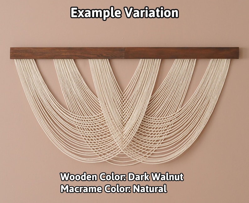 May include: A wall hanging featuring a dark walnut wooden bar with natural off-white macrame cord draped in multiple overlapping U-shaped loops. The text Example Variation, Wooden Color: Dark Walnut, and Macrame Color: Natural is visible.