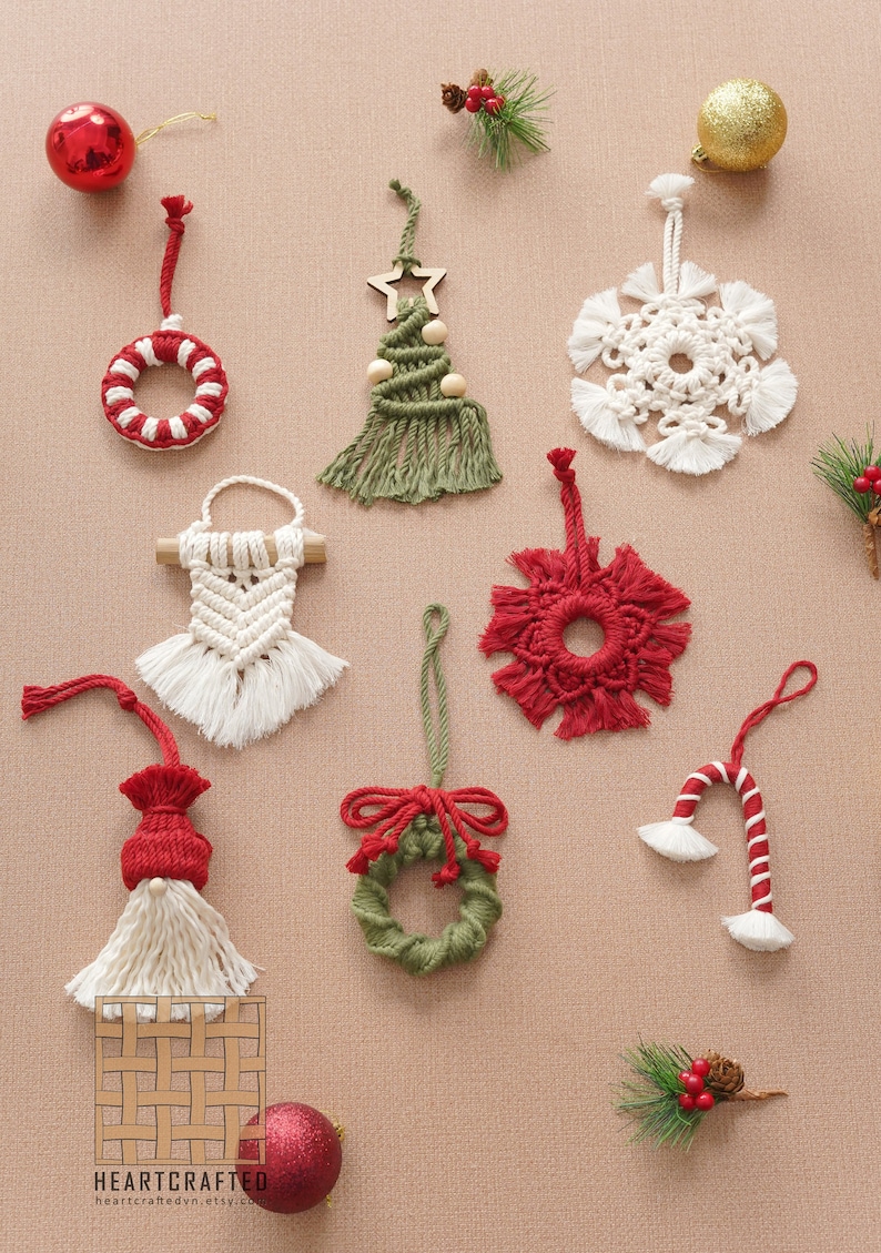 May include: A collection of handmade macrame Christmas ornaments in various colors and designs, including a wreath, a tree, a snowflake, a candy cane, and a gnome. The ornaments are displayed on a beige background with red and green accents.