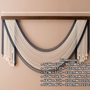 May include: A large wall hanging made of white and black yarn, with a curved shape. The hanging is attached to a wooden dowel rod. Dimensions are listed in inches and centimeters: +36"W x 22"H - 90cmW x 55 cmH, +44"W x 27.2"H - 110cmW x 68 cmH, +52"W x 32"H - 130cmW x 80cmH, +60"W x 36.8"H - 150cmW x 92 cmH, +68"W x 42"H - 170cmW x 105cmH, +76"W x 46"H - 190cmW x 115 cmH.