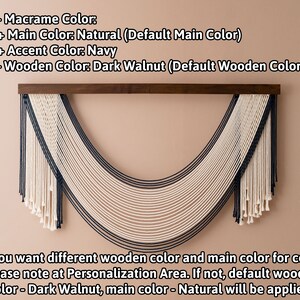 May include: A macrame wall hanging with a curved shape. The main cord is natural white, with navy blue accent cords. The hanging is mounted on a dark walnut wood dowel. The text reads: "Macrame Color: Main Color: Natural (Default Main Color) Accent Color: Navy Wooden Color: Dark Walnut (Default Wooden Color) If you want different wooden color and main color for cord, please note at Personalization Area. If not, default wooden color - Dark Walnut, main color - Natural will be applied."