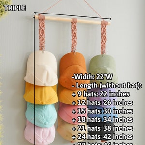 May include: A macrame hat rack with a wooden dowel and three hanging straps. The rack is designed to hold multiple hats, with a width of 22 inches. The length varies depending on the number of hats, ranging from 22 to 50 inches.