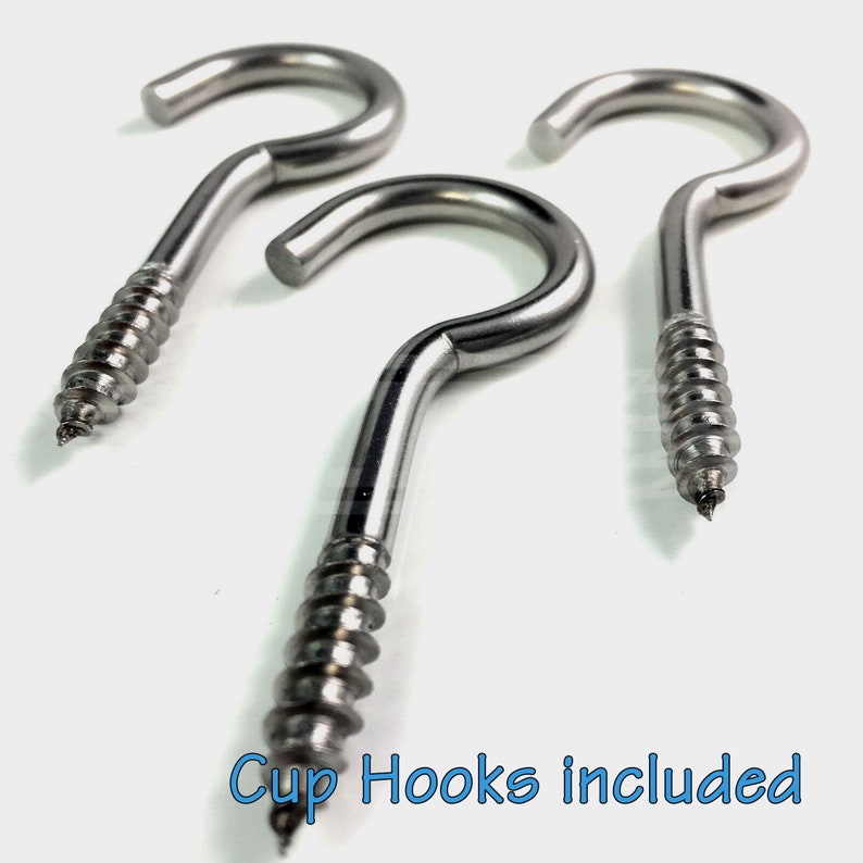 May include: Three silver screw-in cup hooks. The hooks are made of metal and have a shiny finish. The hooks are designed to be screwed into a surface, such as a wall or ceiling.  "Cup Hooks included" is written in blue text at the bottom of the image.