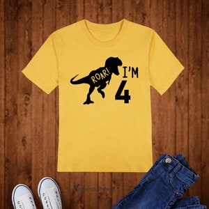 May include: Yellow short-sleeved t-shirt with a black dinosaur silhouette and the text "Roar! I'm 4".
