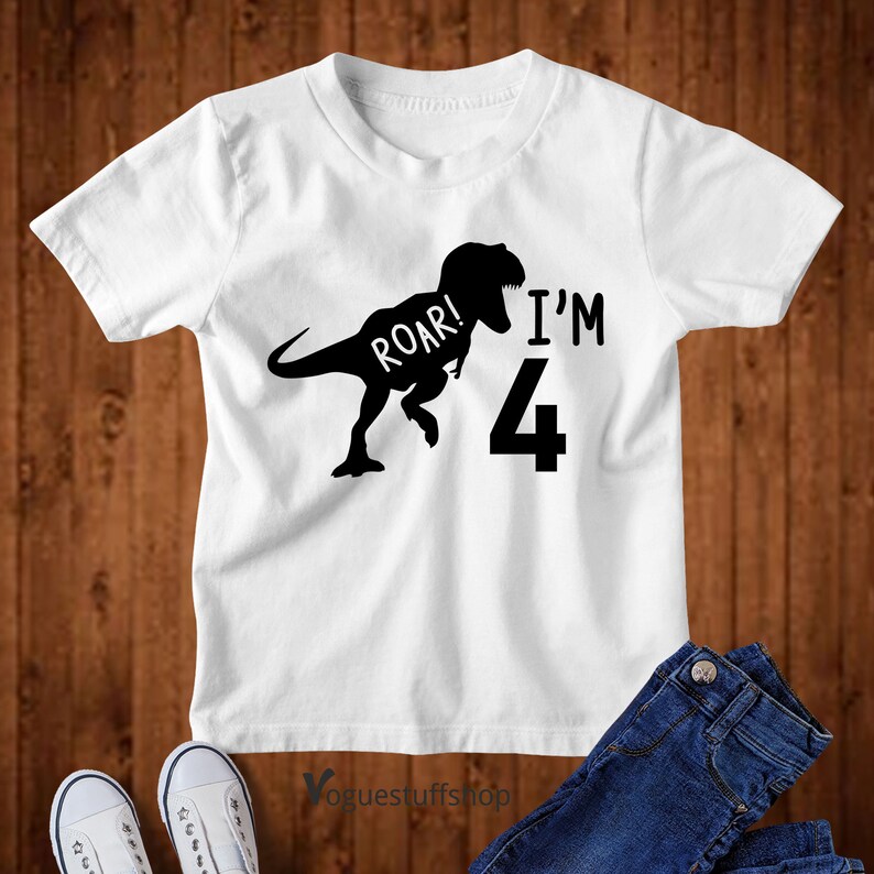 May include: White t-shirt with a black dinosaur silhouette and the text "Roar! I'm 4".